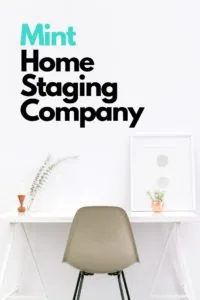 Mint Home Staging Company logo above minimalist white desk with sage green chair, vase with dried flowers, and framed artwork